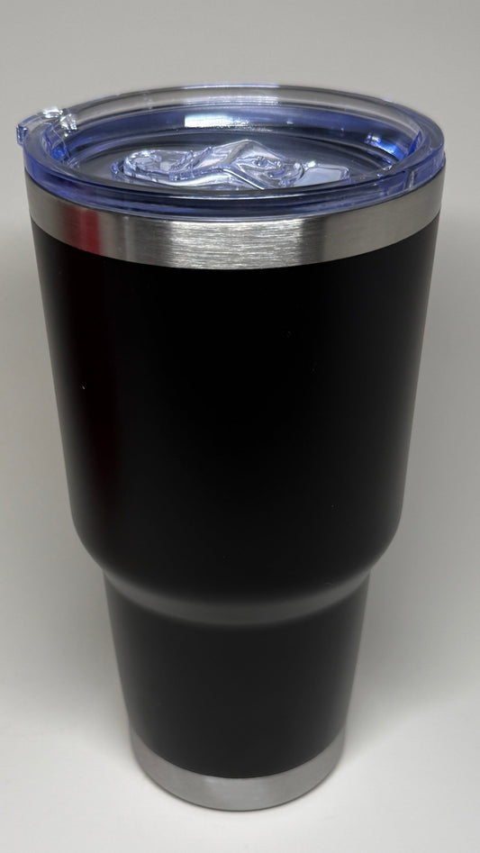 Black tumbler with a silver rim on a white background