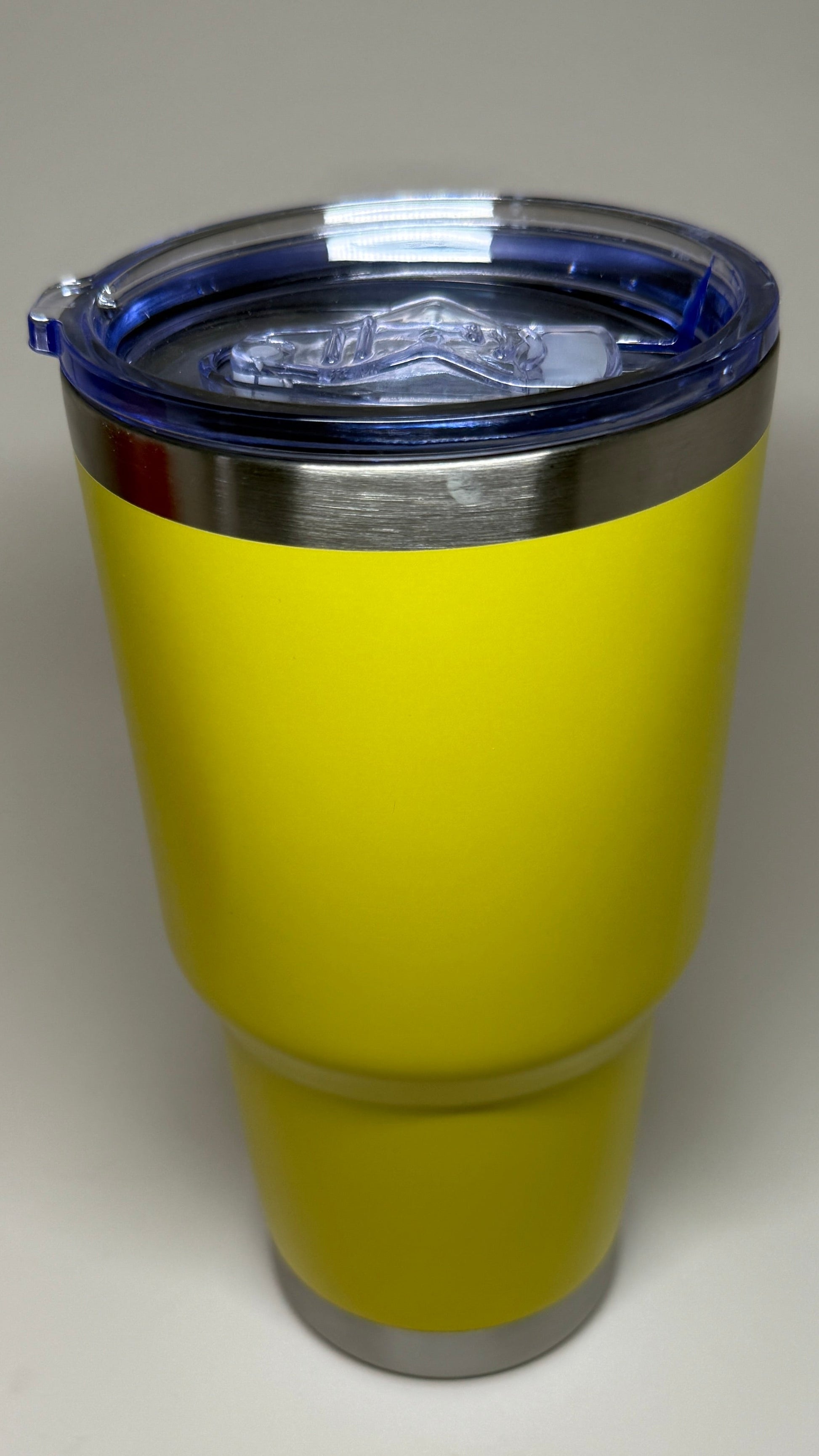Yellow tumbler with a lid 