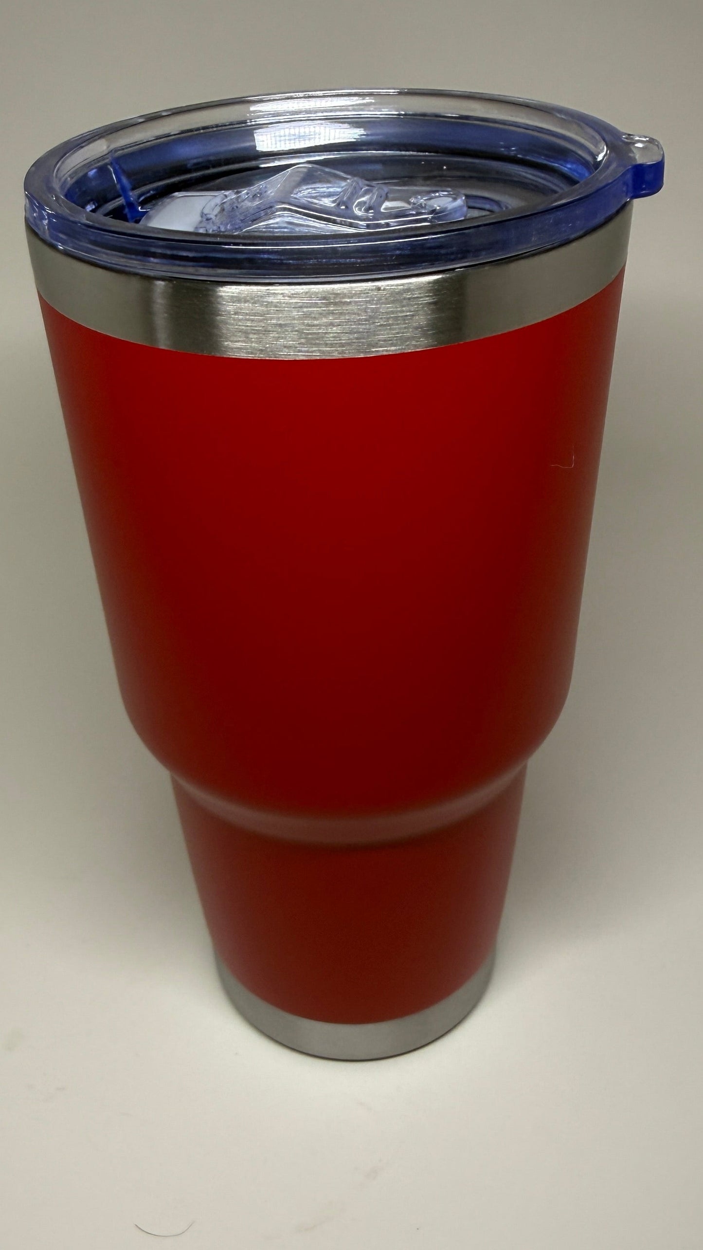 Red tumbler with a lid